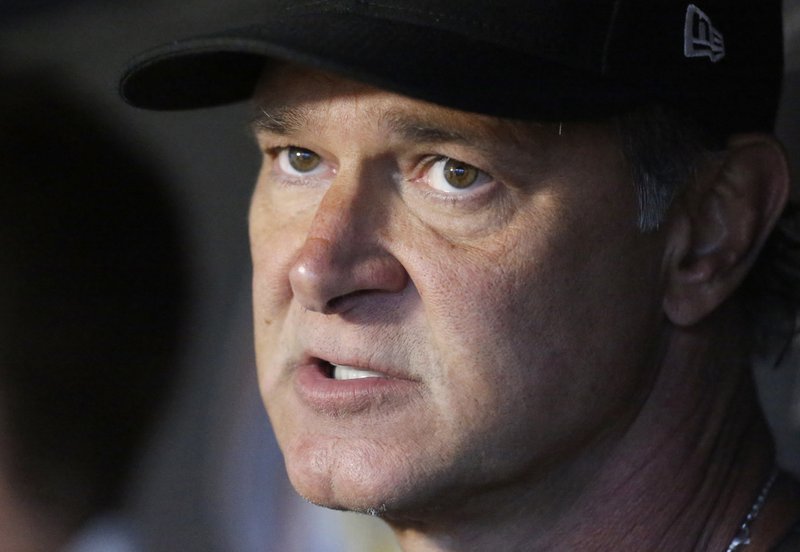 FILE - In this July 27, 2018, file photo, Miami Marlins manager Don Mattingly speaks with members of the media before the start of a baseball game against the Washington Nationals, in Miami. Mattingly says he's not dwelling on whether he belongs in the Hall of Fame. A day after Harold Baines was a surprising choice for the Hall, Mattingly says he's content knowing what he accomplished on the field. &quot;I just didn't play long enough. Wasn't able to stay healthy long enough to really put that pile of numbers together,&quot; he said at the winter meetings in Las Vegas, Monday, Dec. 10, 2018. (AP Photo/Wilfredo Lee, File)