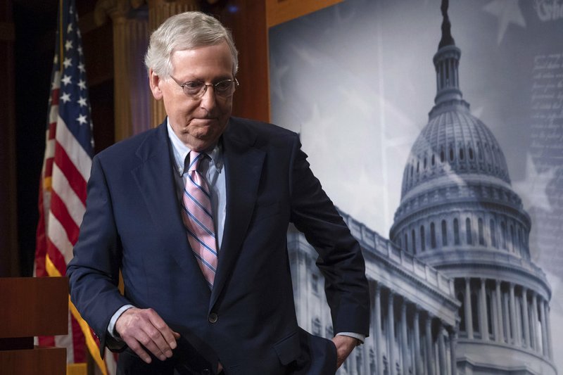 FILE - In this Oct. 6, 2018 file photo, Senate Majority Leader Mitch McConnell, R-Ky., finishes speaking to reporters at the Capitol in Washington. McConnell's blockade of a popular criminal justice reform package has angered top senators. And it's created an unusual rift with a longtime Republican ally, Sen. Chuck Grassley of Iowa. (AP Photo/J. Scott Applewhite)