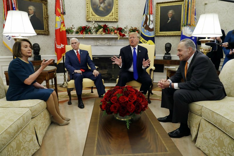 President Donald Trump and Vice President Mike Pence meet with Senate Minority Leader Chuck Schumer, D-N.Y., and House Minority Leader Nancy Pelosi, D-Calif., in the Oval Office of the White House, Tuesday, Dec. 11, 2018, in Washington. (AP Photo/Evan Vucci)