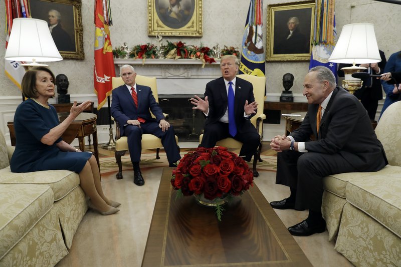 President Donald Trump and Vice President Mike Pence meet with Senate Minority Leader Chuck Schumer, D-N.Y., and House Minority Leader Nancy Pelosi, D-Calif., in the Oval Office of the White House, Tuesday, Dec. 11, 2018, in Washington. (AP Photo/Evan Vucci)

