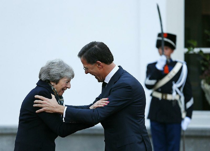 Dutch Prime Minister Mark Rutte greets British Prime Minister Theresa May as she arrives Tuesday in The Hague, Netherlands, as part of her search for support from European leaders to persuade the British Parliament to accept her proposal for exiting the European Union. May said she found “a shared determination” among the leaders to promote the deal, which so far lacks support in Parliament. 