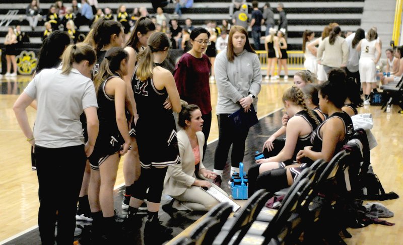 MARK HUMPHREY ENTERPRISE-LEADER Lincoln head girls basketball coach Emilianne Slammons outlines strategy during a time-out. The Lady Wolves completed the non-conference schedule with a 7-3 record.