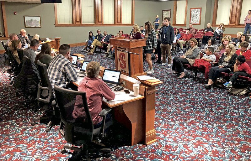 NWA Democrat-Gazette/ANDY SHUPE
Members of the staffs of the Har-Ber Herald, the student newspaper at Har-Ber High School, and the school's yearbook, speak Tuesday, Dec. 11, 2018, to the Springdale School Board during a public comment portion of the Board's meeting in Springdale.