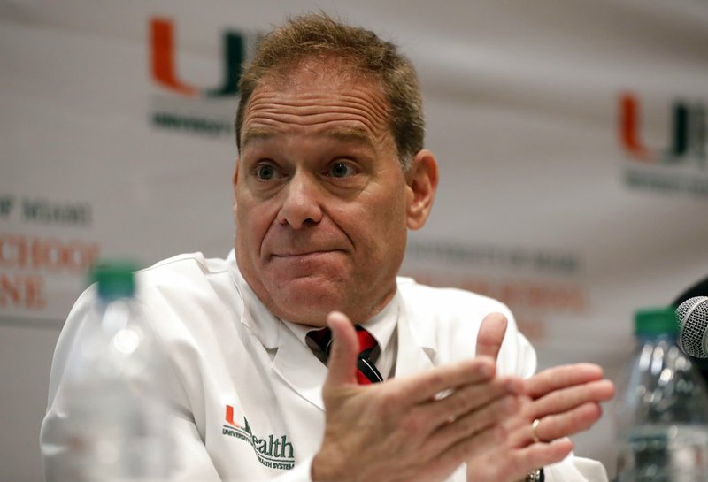 Dr. Michael Hoffer, of the University of Miami Miller School of Medicine, speaks during a news conference, Wednesday, Dec. 12, 2018, in Miami. Hoffer and a group of doctors presented their findings in the case of U.S. diplomats who experienced mysterious health incidents while working at the U.S. Embassy in Havana. (AP Photo/Lynne Sladky)