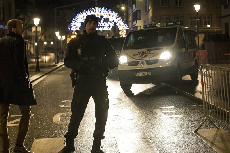 Emergency services patrol at the center of the city of Strasbourg following a shooting, eastern France, Tuesday Dec. 11, 2018. A man who had been flagged as a possible extremist sprayed gunfire near the city of Strasbourg's famous Christmas market Tuesday, killing three people, wounding 12 and sparking a massive manhunt. France immediately raised its terror alert level.(AP Photo/Jean-Francois Badias)