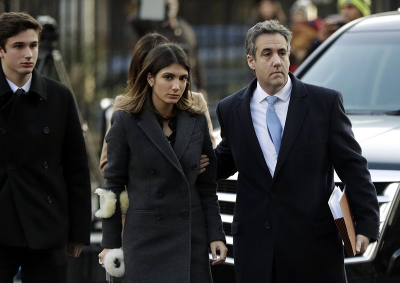 Michael Cohen, right, President Donald Trump's former lawyer, arrives at federal court with his daughter, Samantha Cohen, center, and son, Jake Cohen, for his sentencing for dodging taxes, lying to Congress and violating campaign finance laws in New York on Wednesday, Dec. 12, 2018. (AP Photo/Julio Cortez)

