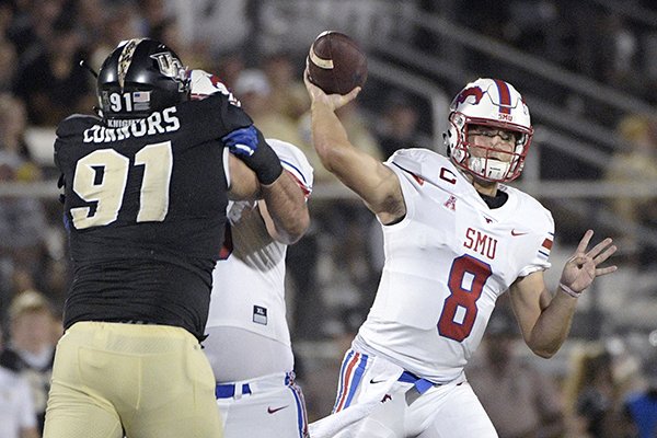 SMU quarterback Ben Hicks (8) throws a pass in front of Central Florida defensive lineman Joey Connors (91) during the first half of an NCAA college football game Saturday, Oct. 6, 2018, in Orlando, Fla. (AP Photo/Phelan M. Ebenhack)