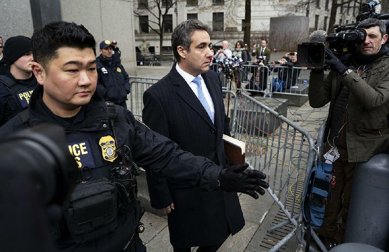 Michael Cohen leaves court Wednesday in New York after sentencing. In an emotional apology in court, Cohen, 52, said blind loyalty to Donald Trump led him to ignore “my own inner voice and my moral compass.” 