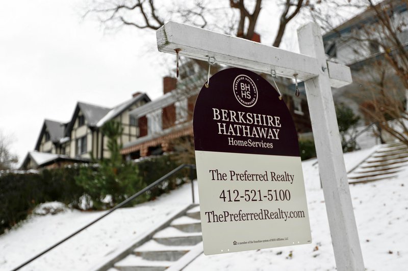 FILE- In this Nov. 28, 2018, file photo a realtor sign hangs in front of a home for sale in Pittsburgh. On Thursday, Dec. 13, Freddie Mac reports on this week's average U.S. mortgage rates. (AP Photo/Keith Srakocic, File)