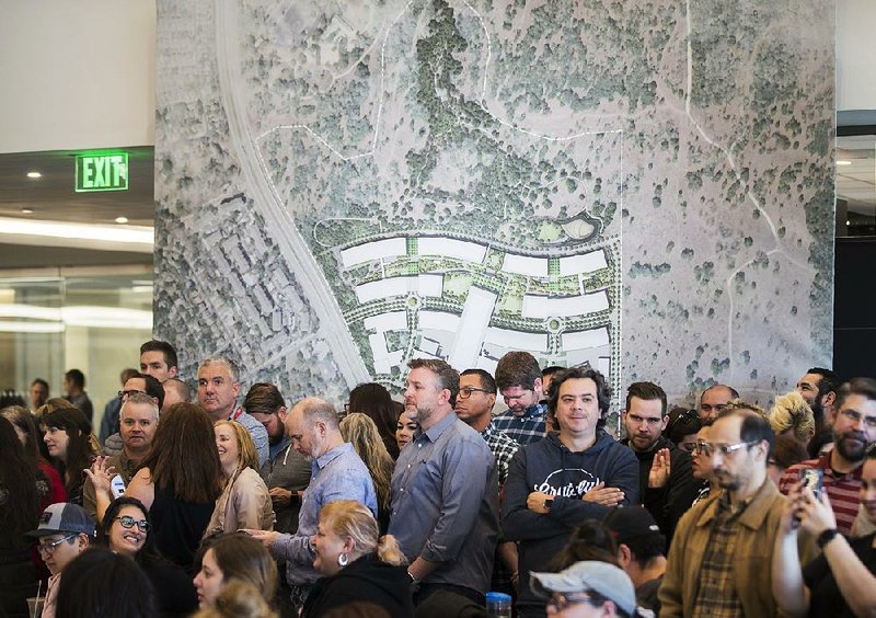 Apple employees in Austin, Texas, attend the company’s announcement Thursday that it will build a new $1 billion campus in Austin. 