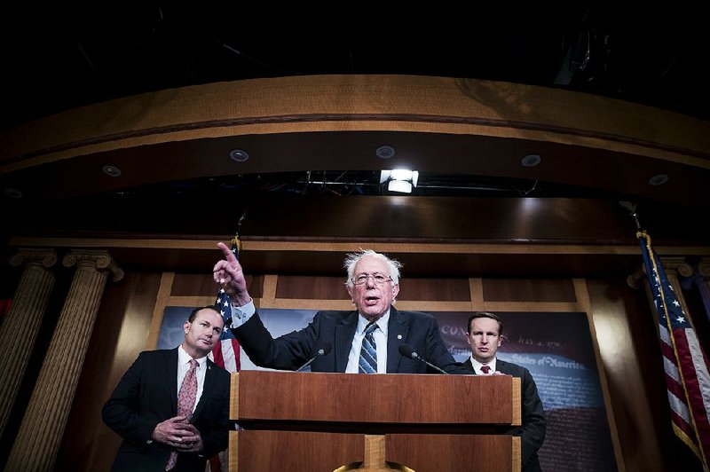 Sen. Bernie Sanders (center), I-Vt., with Sen. Mike Lee, R-Utah, (left) and Sen. Chris Murphy, D-Conn., hails Thursday’s Senate vote to condemn Saudi Crown Prince Mohammed bin Salman and call for an end to U.S. involvement in the Saudi-led war in Yemen. “Today we tell the despotic regime in Saudi Arabia that we will not be part of their military adventurism,” Sanders said. 