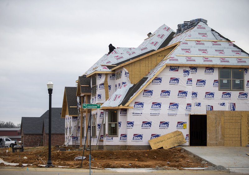 NWA Democrat-Gazette/FILE PHOTO Construction on new homes in Bentonville.