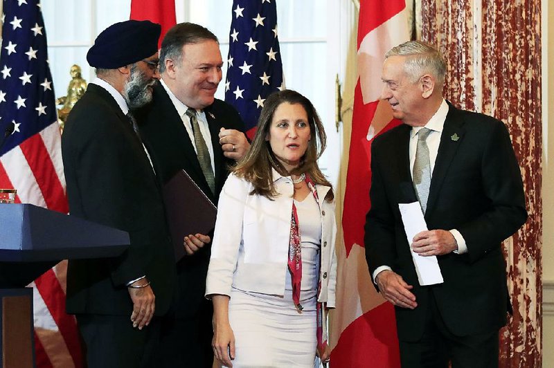 Canadian Defense Minister Harjit Sajjan (from left), Secretary of State Mike Pompeo, Canadian Foreign Affairs Minister Chrystia Freeland and Defense Secretary James Mattis conclude their news conference Friday in Washington. 