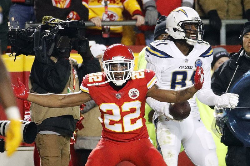 Kansas City Chiefs defensive back Orlando Scandrick (22) complains to an official after Mike Williams (right) of the Los Angeles Chargers caught a touchdown with four seconds remaining in Thursday night’s game. Williams then scored a two-point conversion to give the Chargers a 29-28 victory.
