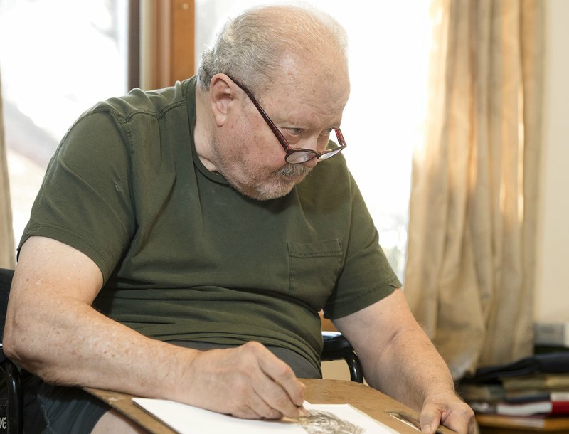 In this on Friday, Dec. 7, 2018 photo, Robert Sharp draws in his room at Orchard Park Assisted Living in Lincoln, Neb. Sharp, who has Parkinson's disease, has been drawing ever since he was a boy (Gwyneth Roberts/Lincoln Journal Star via AP)