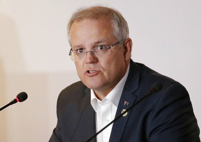 In this Nov. 18, 2018, file photo, Australian Prime Minister Scott Morrison speaks during the APEC 2018 meetings in Port Moresby, Papua New Guinea. Australia has decided to formally recognize west Jerusalem as Israel's capital, but won't move its embassy until there's a peace settlement between Israel and Palestinians, Prime Minister Morrison announced Saturday. (AP Photo/Aaron Favila, File)