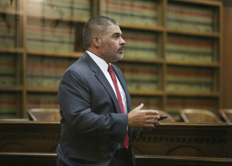 In this Oct. 17, 2018 photo, McLennan County District Attorney Abelino Reyna arrives for a hearing in 54th District Court during a hearing in Waco, Texas. Local leaders say a plea deal allowing a former Baylor University fraternity president to serve no jail times highlights the outsized influence alumni play in shaping the criminal justice system in and around Waco. Jacob Walter Anderson was accused of raping a woman outside a 2016 fraternity party. The plea agreement allows him to avoid jail or being listed as a sex offender. The judge, prosecutor and defense attorney in the case all have degrees from Baylor. (Rod Aydelotte/Waco Tribune-Herald via AP)