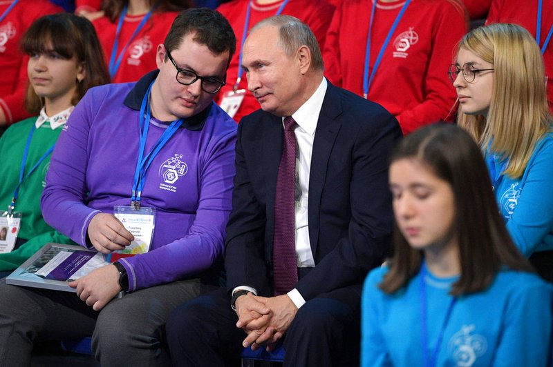 Russian President Vladimir Putin, center, attends a high-tech forum for youth in Yaroslavl, Russia, Thursday, Dec. 13, 2018. Putin said that Russia has a big potential for the development of high-tech industries. (Alexei Druzhinin, Sputnik, Kremlin Pool Photo via AP)