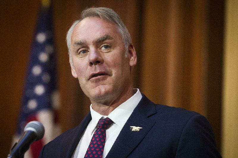 Outgoing Secretary of the Interior Ryan Zinke, shown at a news conference last week, said in his resignation letter that the federal investigations he faces are based on “meritless and false claims.”