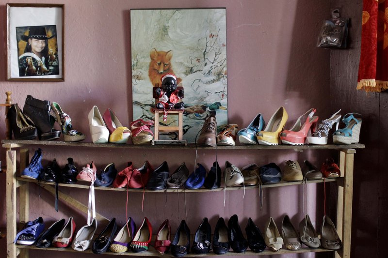 AP/FRANKLIN REYES In this photo taken in late 2013, shoes for sale are displayed on a shelf inside the home of a small business owner in Havana. 