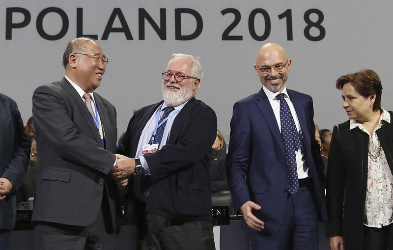 Heads of the delegations react at the end of the final session of the COP24 summit on climate changein Katowice, Poland, Saturday, Dec. 15, 2018. (AP Photo/Czarek Sokolowski)