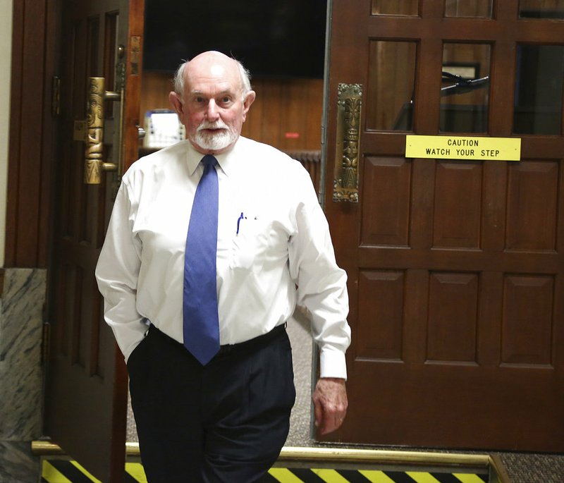 FILE - In this April 19, 2018 file photo, State District Court Judge Ralph Strother leaves his courtroom at the McLennan County Courthouse in Waco, Texas. Judge Strother who accepted a plea deal allowing a former Baylor University student accused of rape to avoid jail time holds three degrees from Baylor. The District Attorney overseeing the case holds two Baylor degrees. The prosecutor who proposed the plea agreement graduated from Baylor law school. (Rod Aydelotte/Waco Tribune-Herald via AP File)