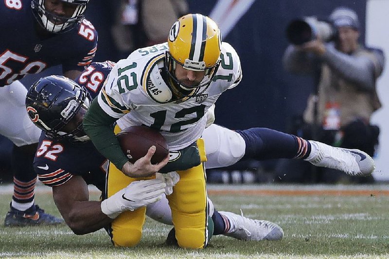 Chicago Bears linebacker Khalil Mack (left) sacks Green Bay Packers quarterback Aaron Rodgers during Sunday’s game at Soldier Field in Chicago.