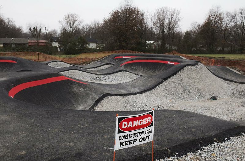 A new pump track will serve as the centerpiece of what eventually will be a mile-long bike skills trail on the east side of the Thaden School in Bentonville.