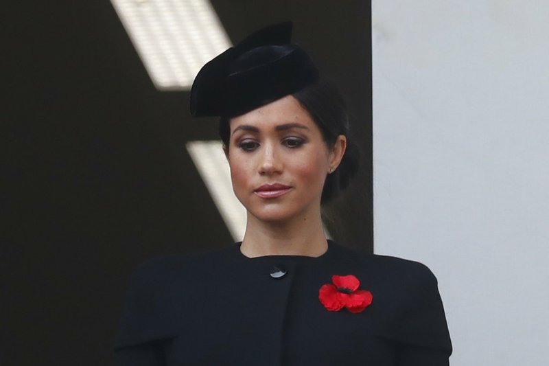 FILE - In this Nov. 11, 2018 file photo, Meghan Markle, Duchess of Sussex, attends the Remembrance Sunday ceremony at the Cenotaph in London. Meghan Markle's father appealed to his daughter to call him, saying on Monday, Dec. 17, 2018, that they hadn't been in touch since her wedding to Prince Harry in May. (AP Photo/Alastair Grant, File)