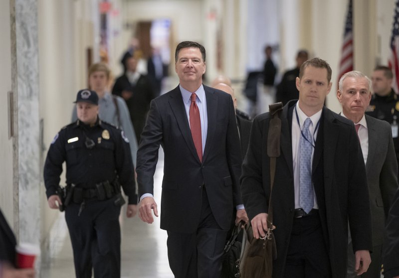 Former FBI Director James Comey arrives on Capitol Hill in Washington, Monday, Dec. 17, 2018, to testify under subpoena in a second closed-door interview with the GOP-led House Judiciary and Oversight Committees in their probe of conduct by federal law enforcement officials in the investigation of President Donald Trump's alleged Russia ties, and Hillary Clinton's emails. (AP Photo/J. Scott Applewhite)