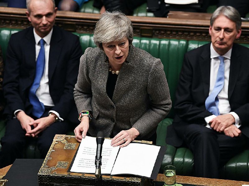 Prime Minister Theresa May delivers a speech in the House of Commons in London. 