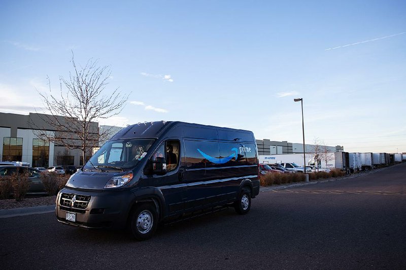 An Amazon.com Inc. delivery van passes outside the Drago Fleet LLC facility in Denver on Friday. Amazon CEO Jeff Bezos appealed earlier this year to aspiring entrepreneurs, offering them a chance to start their own businesses making Amazon deliveries. 