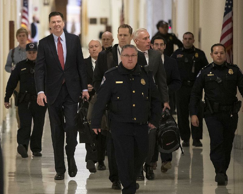 Former FBI Director James Comey arrives on Capitol Hill on Monday to testify under subpoena in a second closed interview with the GOP-led House Judiciary and Oversight committees in their probe of conduct by federal law enforcement officials in the investigations of President Donald Trump’s campaign and Hillary Clinton’s emails.