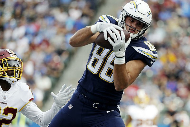 Los Angeles Chargers tight end Hunter Henry makes a touchdown catch during the first half Dec. 10, 2017, against the Washington Redskins. Henry took part in his first practice Monday since tearing the anterior cruciate ligament in his right knee nearly seven months ago.