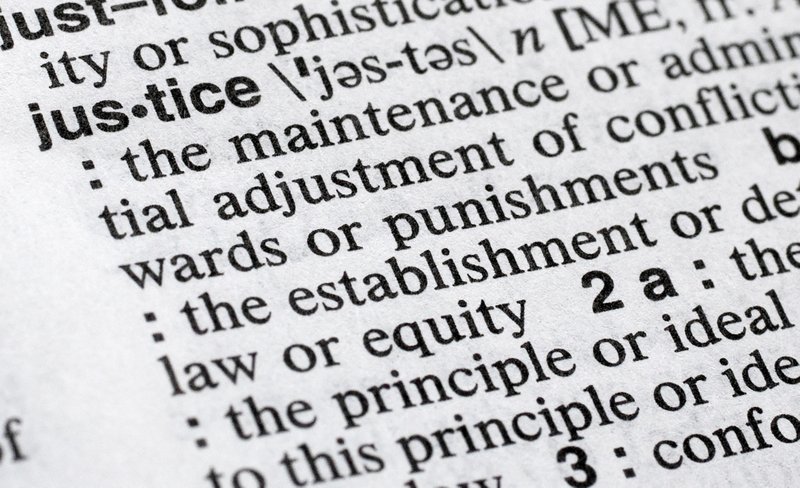 In this Dec. 12, 2018, photo, &quot;justice&quot; is displayed in a Merriam-Webster dictionary in New York. Merriam-Webster has chosen &quot;justice&quot; as its 2018 word of the year, driven by the churning news cycle and President Trump's Twitter feed. (AP Photo/Mark Lennihan)
