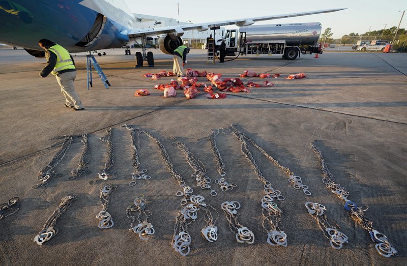 The Associated Press DEPORTATION PLANE: In this Nov. 16 photo, personal belongings of immigrants who entered the United States illegally are loaded onto a plane for a deportation flight to El Salvador by U.S. Immigration and Customs Enforcement in Houston. An obscure division of U.S. Immigration and Customs Enforcement operates hundreds of flights each year to remove immigrants.