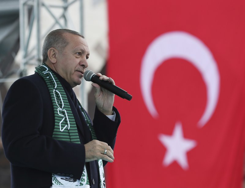 Turkey's President Recep Tayyip Erdogan delivers a speech during a rally in Konya, Turkey, Monday, Dec. 17, 2018. Erdogan said he received &quot;positive answers&quot; from U.S. President Donald Trump on the situation in northern Syria, where Turkey has threatened to launch a new operation against American-backed Syrian Kurdish fighters. The two leaders spoke by phone Friday. (Presidential Press Service via AP, Pool)
