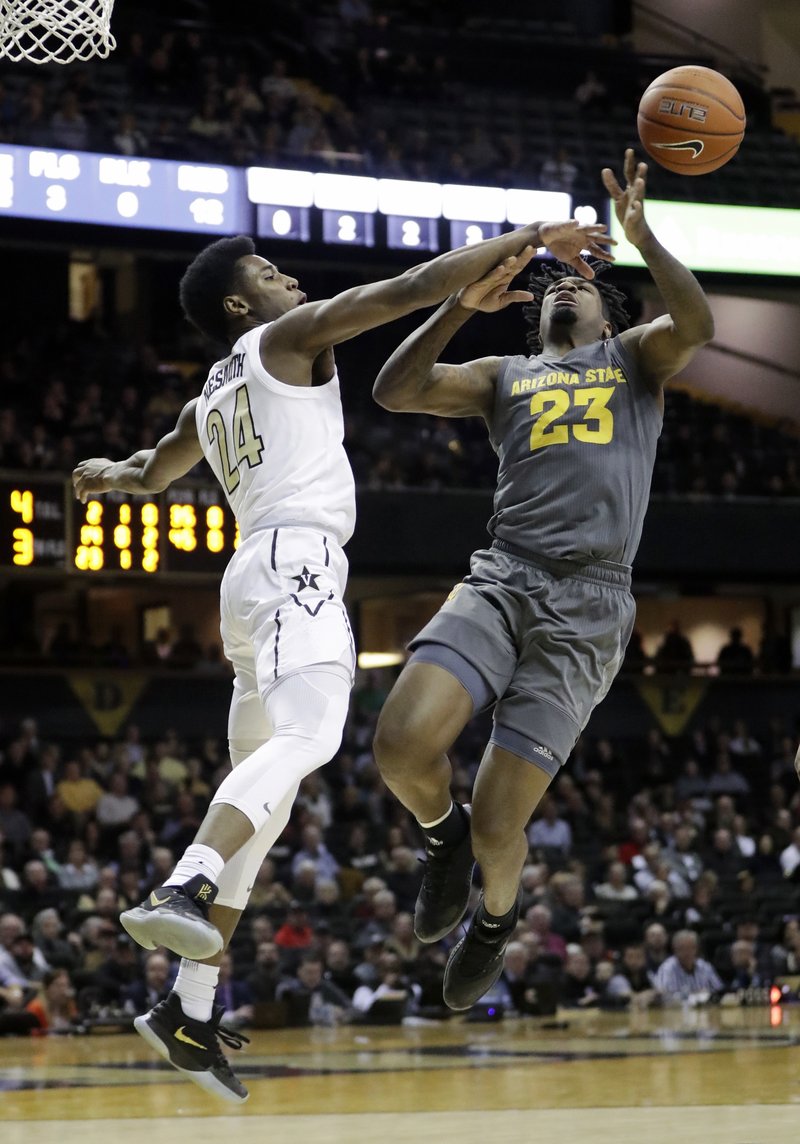 Vanderbilt's Aaron Nesmith (24) knocks the ball away from Arizona State forward Romello White (23) in the first half of an NCAA college basketball game Monday, Dec. 17, 2018, in Nashville, Tenn. (AP Photo/Mark Humphrey)