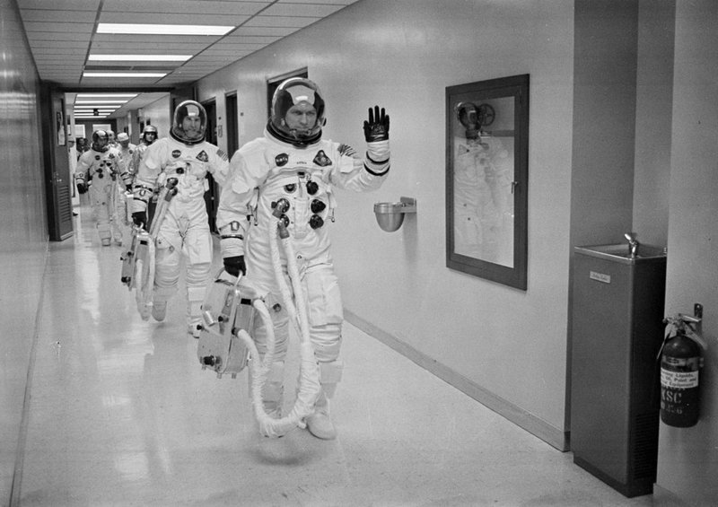 FILE - In this Dec. 21, 1968, file photo made available by NASA, Apollo 8 Commander Col. Frank Borman leads the way as he, and fellow astronauts Command Module Pilot Capt. James A Lovell Jr., and Lunar Module Pilot Maj. William A. Anders head to the launch pad at the Kennedy Space Center in Florida. (NASA via AP, File)