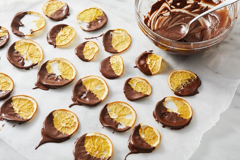 For The Washington Post/TOM MCCORKLE Chocolate-Dipped Orange Crisps