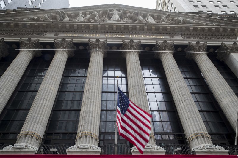 In this Nov. 20, 2018, file photo an American flag flies outside New York Stock Exchange. Stocks are opening solidly higher on Wall Street as the market claims back some of the ground it lost in steep drops over the previous two days. Technology and industrial stocks were among the biggest winners in early trading Tuesday, Dec. 18. (AP Photo/Mary Altaffer, File)