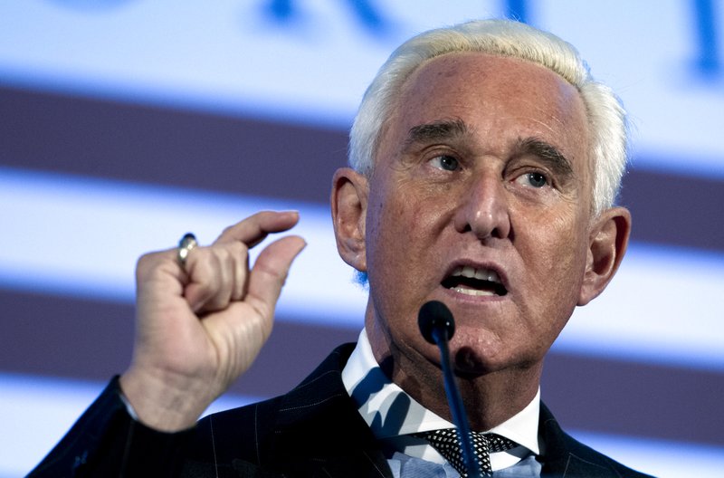  In this Dec. 6, 2018, file photo, Roger Stone speaks at the American Priority Conference in Washington. Former Trump campaign adviser Stone has settled a $100 million lawsuit accusing him of publishing lies on the far-right InfoWars website. 