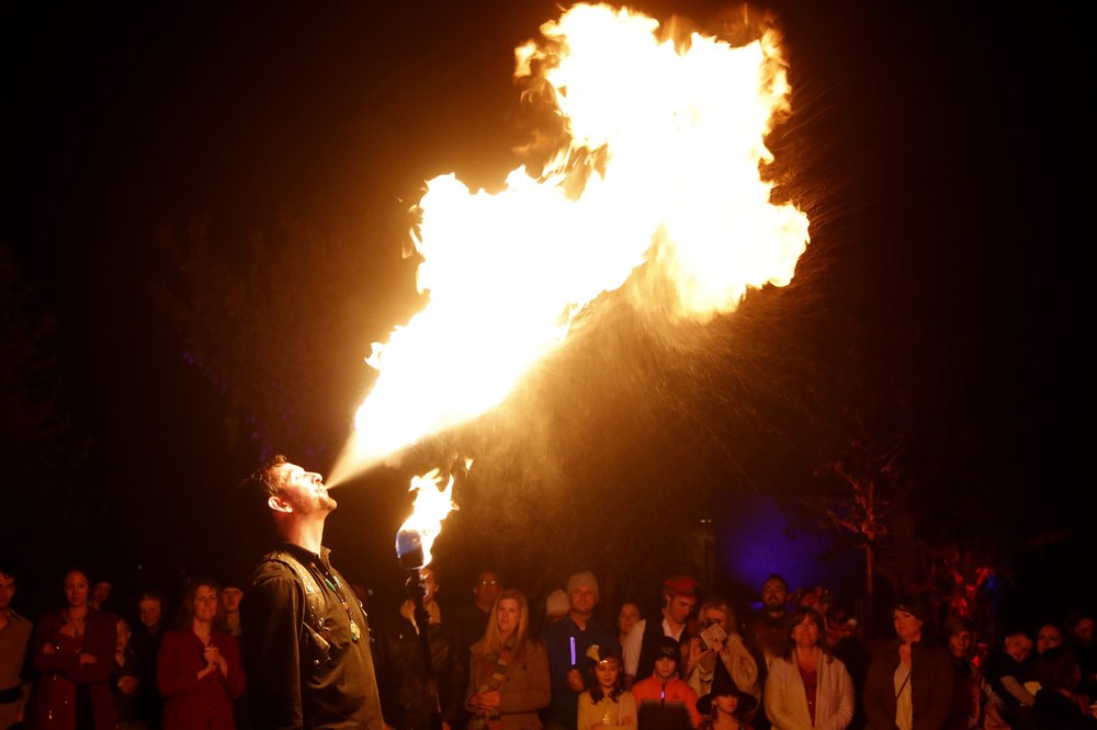 Bryan Blaze breathes fire during his performance at Evermore in Pleasant Grove, Utah. Visitors can just enjoy the sights and performances or can have a more interactive, role-playing experience.