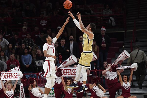 Georgia Tech guard Jose Alvarado shoots over the top of Arkansas guard Isaiah Joe during a game Wednesday, Dec. 19, 2018, in Fayetteville.