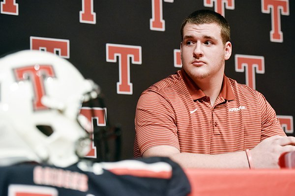 Offensive lineman Beaux Limmer sits on stage during a national signing day event at Robert E. Lee High School in Tyler, Texas, Wednesday, Dec. 19, 2018. Limmer signed to attend the University of Arkansas to play college football. (Chelsea Purgahn/Tyler Morning Telegraph via AP)

