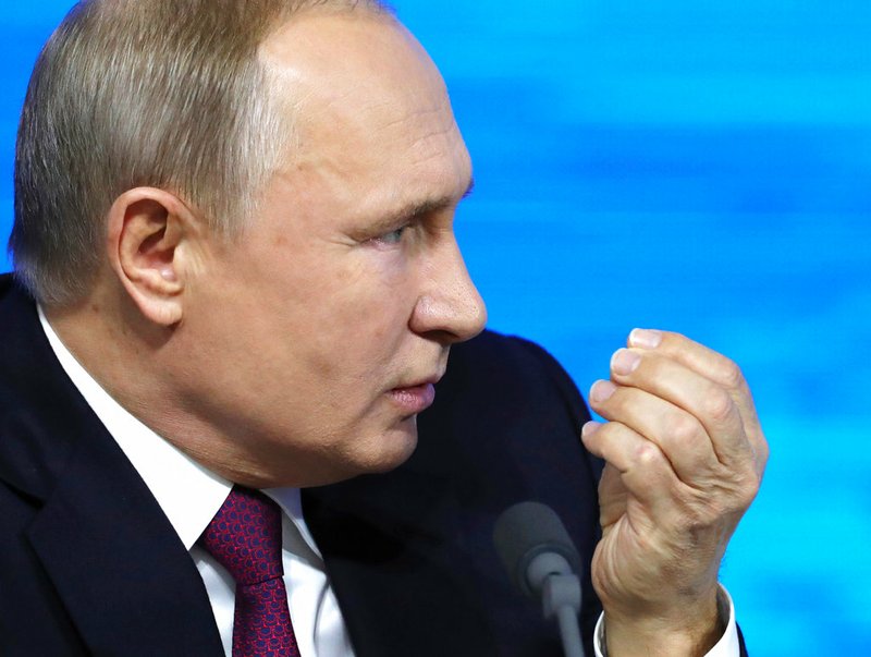 Russian President Vladimir gestures during his annual news conference in Moscow, Russia, Thursday, Dec. 20, 2018. Speaking at news conference Thursday, Putin pointed at the U.S. intention to withdraw from the 1987 Intermediate-Range Nuclear Forces (INF) Treaty. He said that if the U.S. puts intermediate-range missiles in Europe, Russia will be forced to take countermeasures.