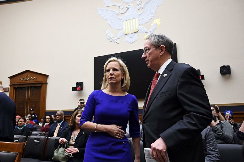 Homeland Security Secretary Kirstjen Nielsen talks with Rep. Bob Goodlatte, R-Va., as she arrives Thursday to testify before the House Judiciary Committee, where she explained new measures that would send asylum seekers who enter the U.S. illegally back to Mexico while they wait for their claims to be processed. 