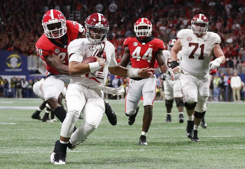 Alabama quarterback Jalen Hurts, shown against Georgia in the SEC Championship Game, remained popular with Crimson Tide fans after losing his starting job to Tua Tagovailoa. 