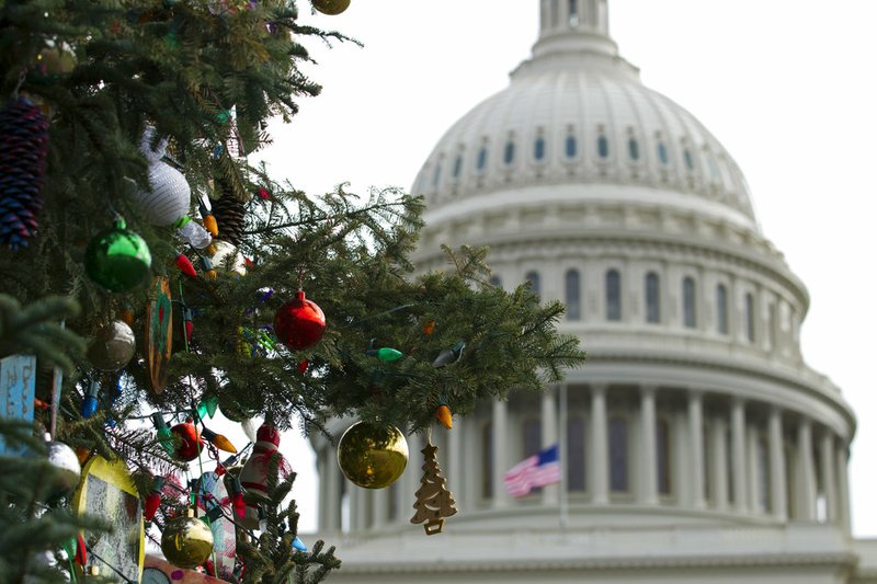 The Capitol Christmas tree decorations are seen outside of The U.S. Capitol in Washington, Friday, Dec. 21, 2018. Republican-led House approved funding for President Donald Trump's border wall in legislation that pushes the government closer to a partial government shutdown. The bill now goes to the Senate. (AP Photo/Jose Luis Magana)