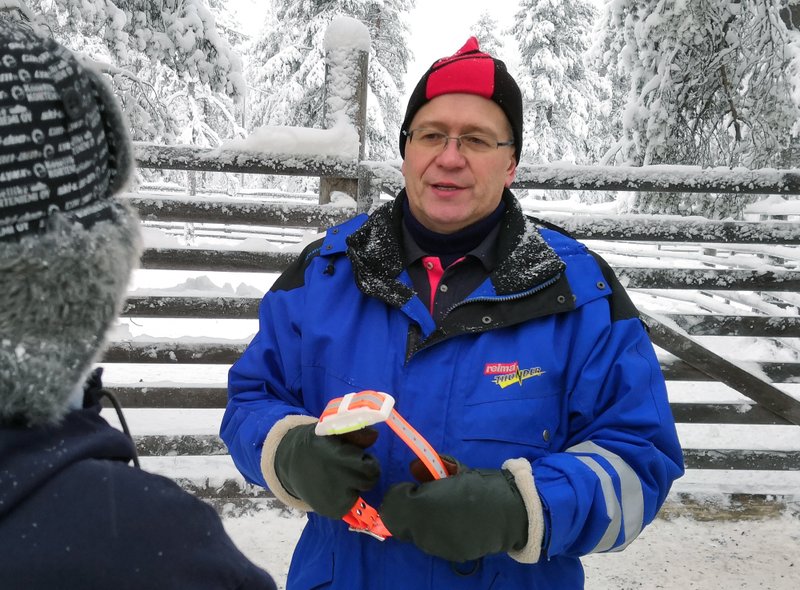 Matti Sarkela from Finland&#x2019;s Reindeer Herding Association holds an internet-connected reindeer collar, that can connect to a smartphone to locate roaming reindeer in Finnish Lapland, in Rovaniemi, Finland, Thursday Dec. 13 2018. To keep track of their animals in Lapland, Northern Finland's vast and remote snow-covered forests, reindeer herders are turning to technology by fitting them with internet-connected collars. (AP Photo/James Brooks)